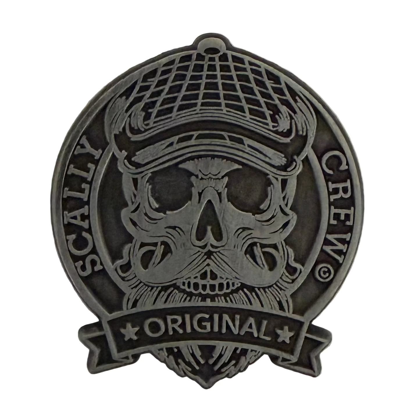 Metallic badge with skull design and 'Scally Crew Original' text on a white background