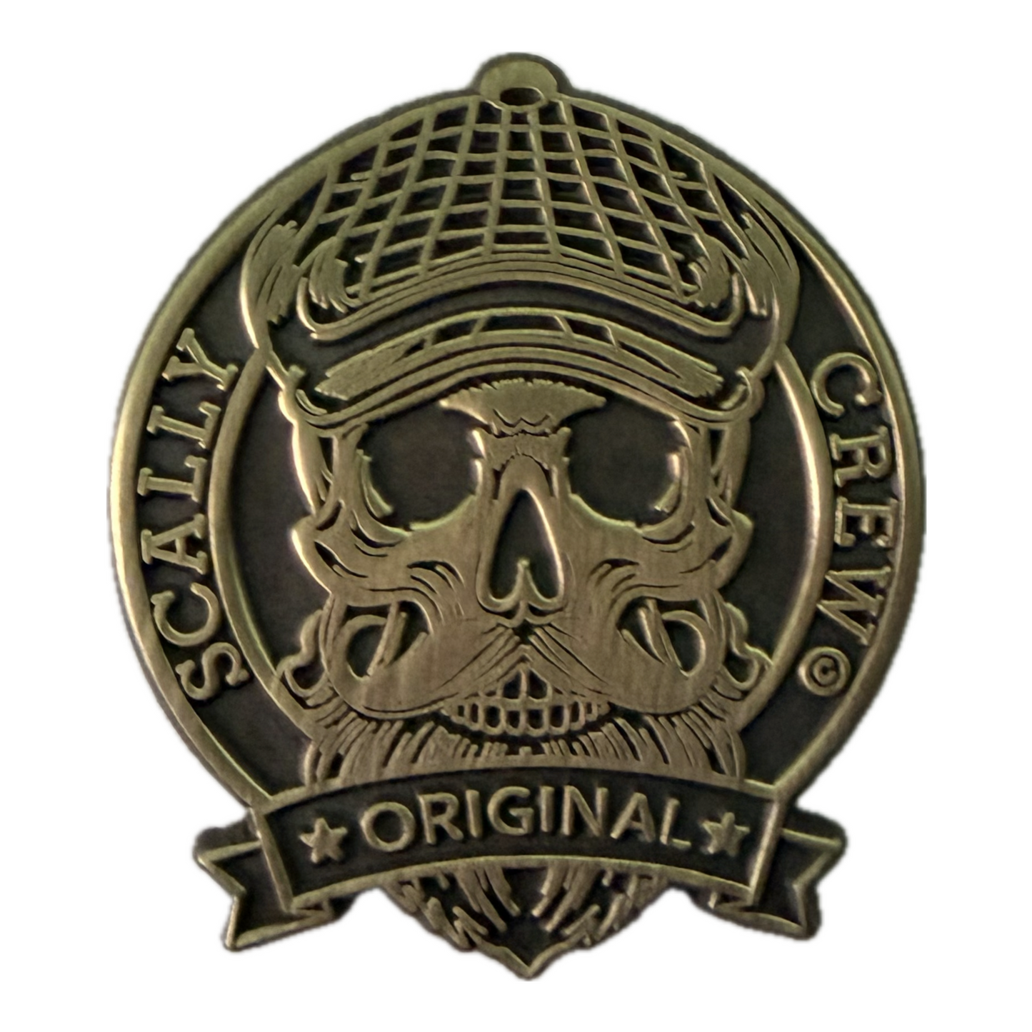 gold Scally crew logo pin on a white background 