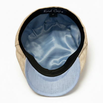 A top-down view of a the inside of a cap with a beige linen-textured crown, a light blue fabric visor, and a light blue satin inner lining. The brand name 'Rad Caps' is visible on the black interior label.