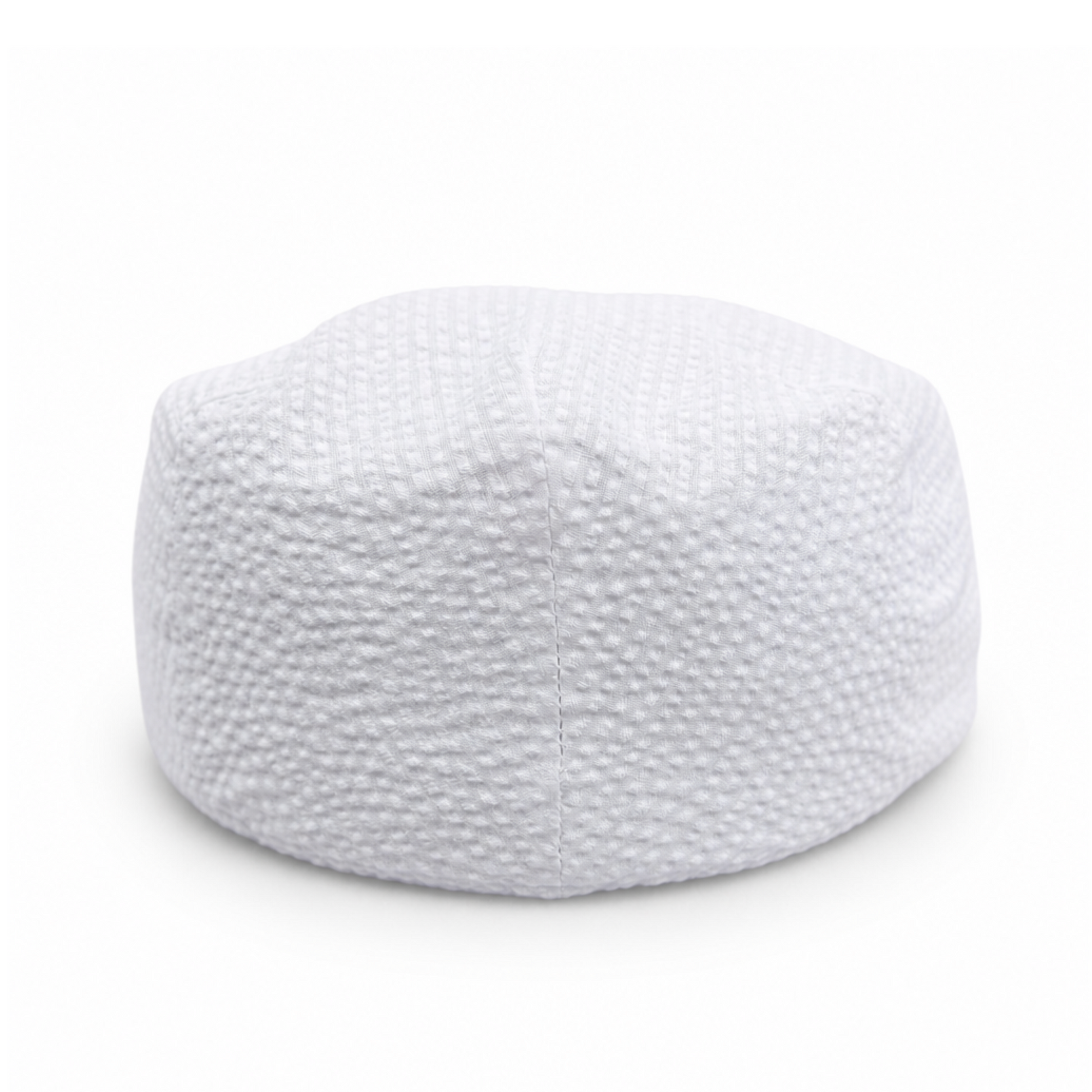 White knitted cap on a white background