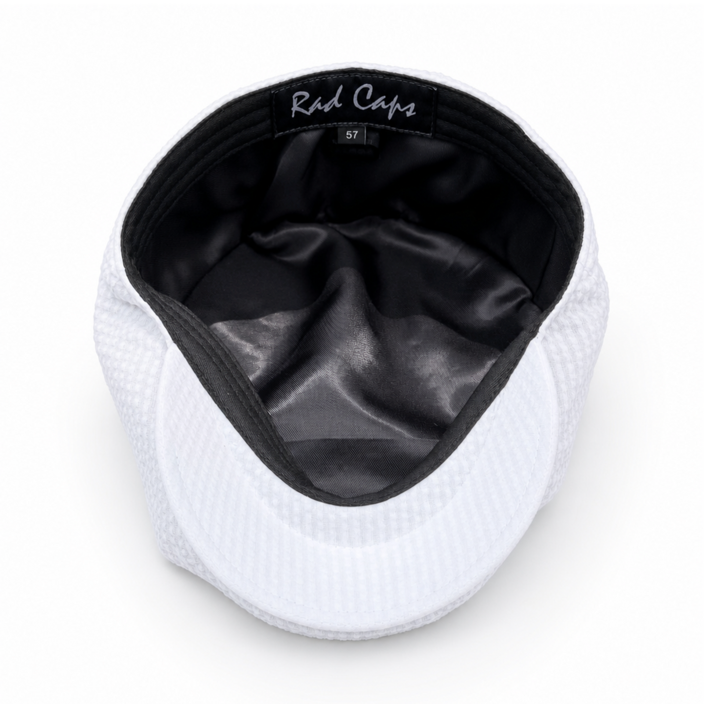 White cap with black interior on a white background