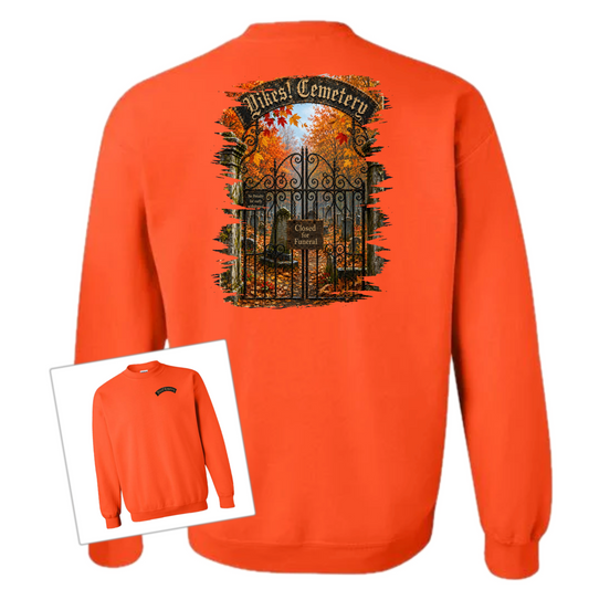 Orange Crewneck sweatshirt with an illustration of a cemetery over a white background 